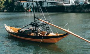 Golden boat on river in Aveiro, Golden Visa ending Portugal update | GetNif