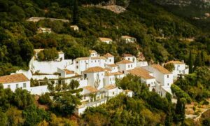 Image of white properties in Portuguese hills, rental income Portugal and property tax | GetNif